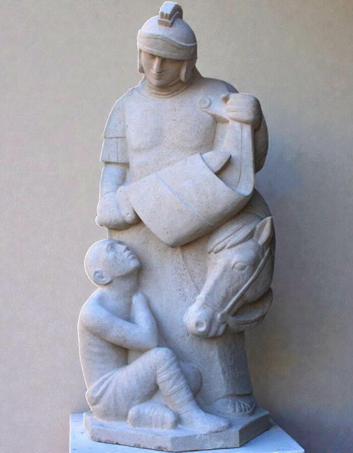 statue de saint Martin en pierre partageant son manteau