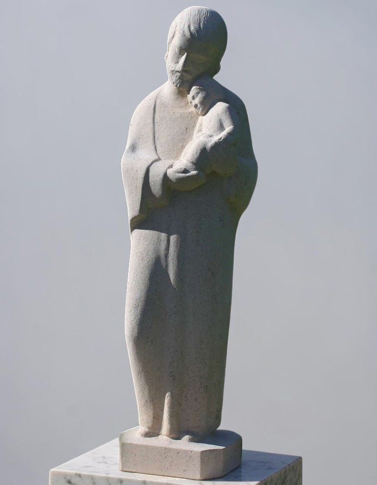statue de st joseph portant l'enfant en pierre par martin damay