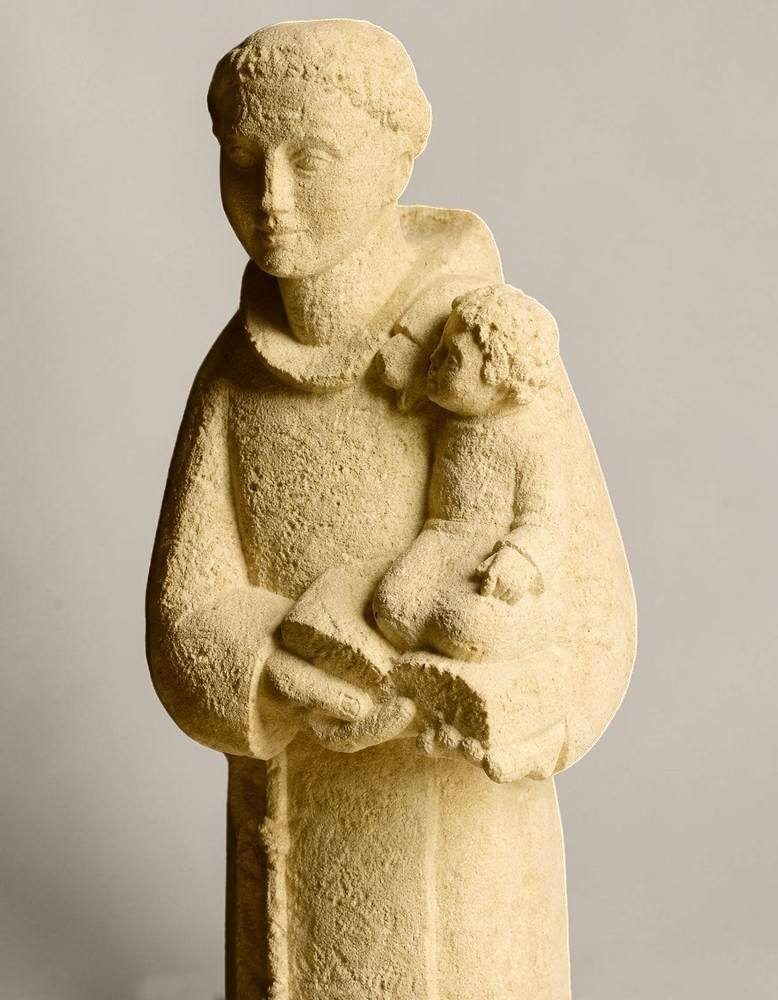 sculpture en pierre de saint antoine avec l'enfant jesus