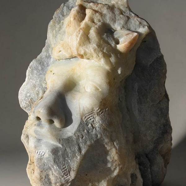 visage d'un faune en pierre d'albatre par martin damay